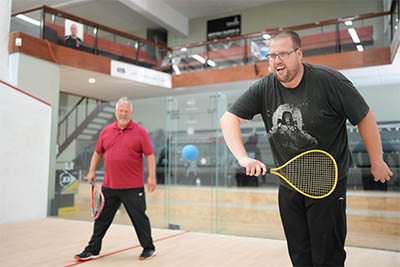 Two men playing on court